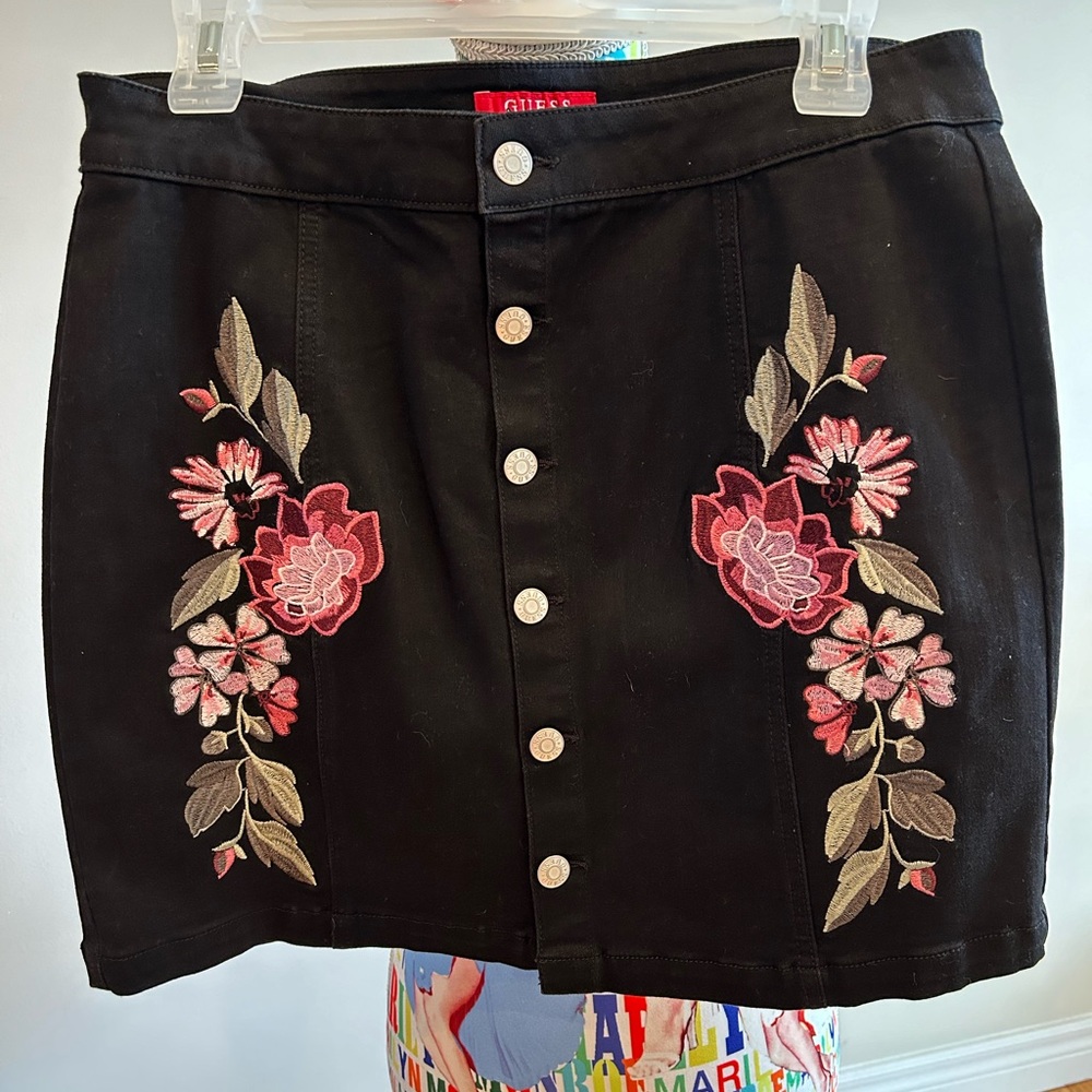 NWOT Guess black denim button up skirt with embroidered details.